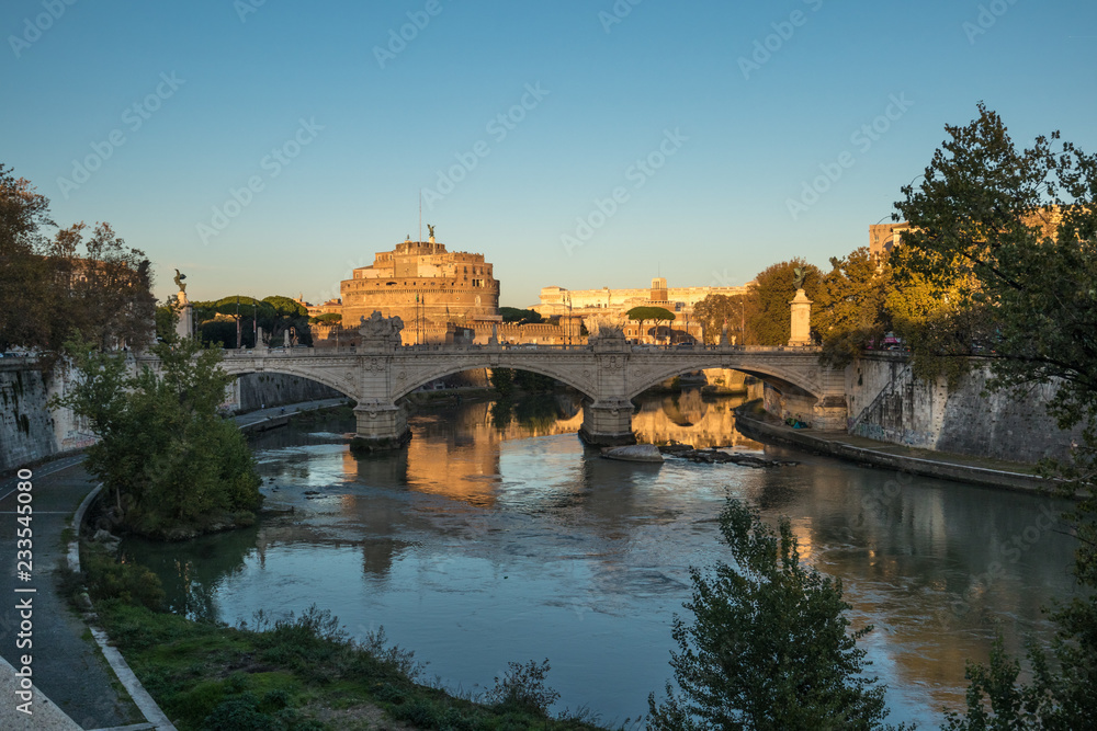 View of Castel Sant'Angelo in Rome at Sunset from the River Tiber and its Natural composition