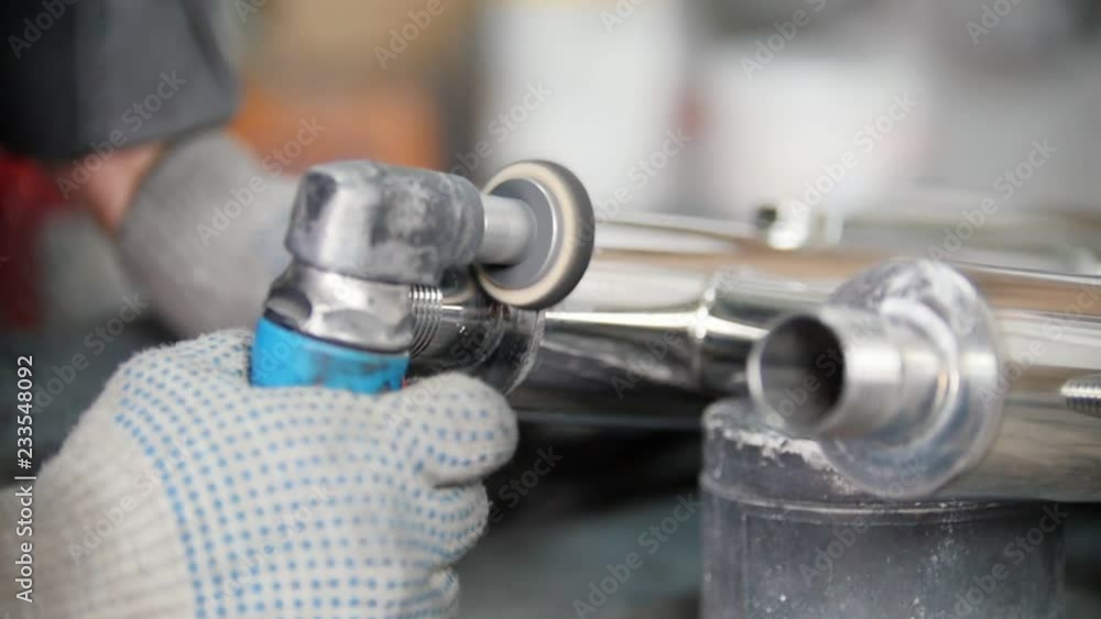 Polishing stainless steel parts at metal factory. Polishing stainless groove Polishing stainless steel parts at metal factory. Polishing stainless groove