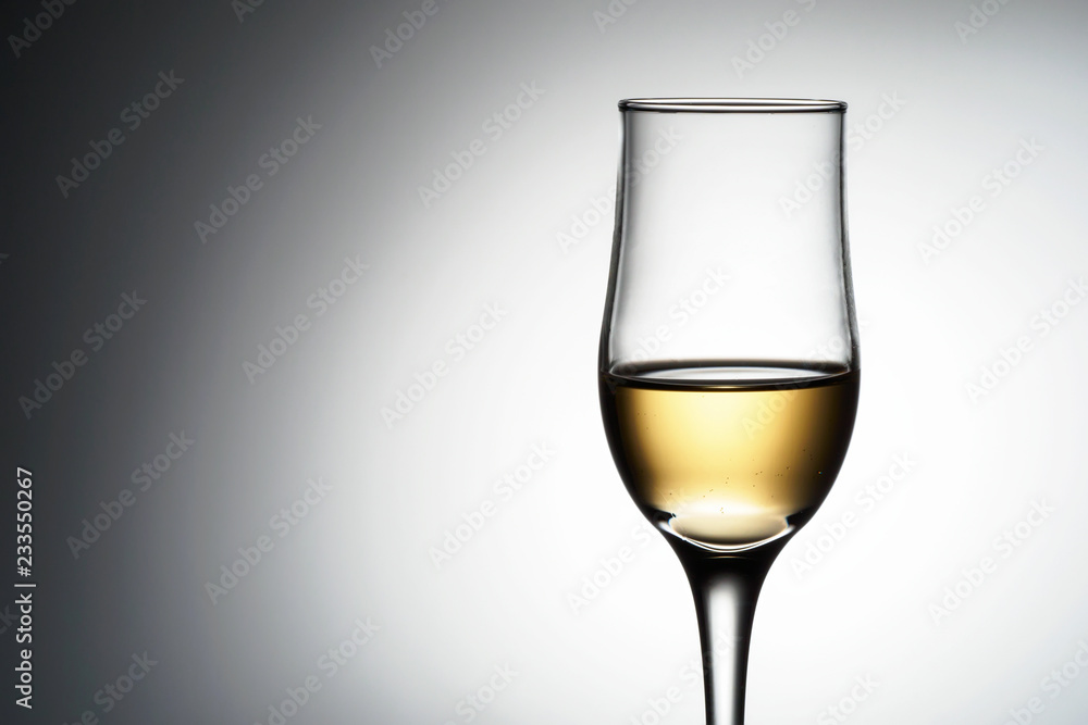 One elegant glass with sparkling champagne One elegant glass with sparkling champagne