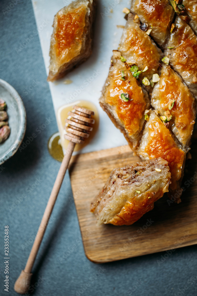 Perfect sweet baklava with pistachio on marble background Perfect sweet baklava with pistachio on marble background