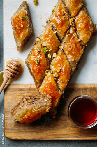  Perfect sweet baklava with pistachio on marble background