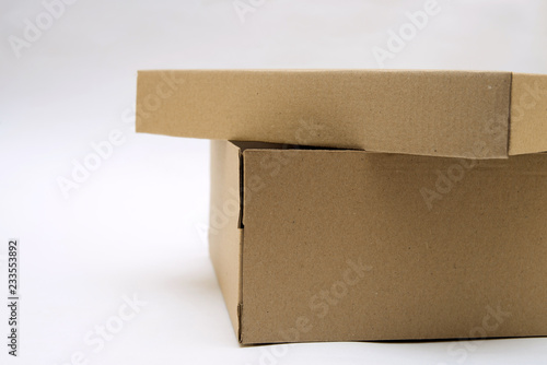 cardboard box with lid lies on white background in different angles