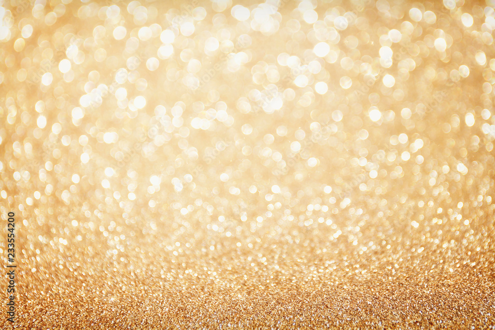 Golden sparkle glitters with bokeh effect and selectieve focus. Festive background with bright gold lights, champagne bubble. Christmas mood concept. Copy space, close up, texture, top view. Golden sparkle glitters with bokeh effect and selectieve focus. Festive background with bright gold lights, champagne bubble. Christmas mood concept. Copy space, close up, texture, top view.