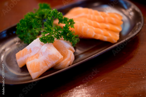 Raw salmons fillet on dish in restaurant
