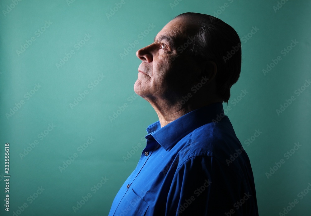 Beautiful older man in front of a colored background Beautiful older man in front of a colored background