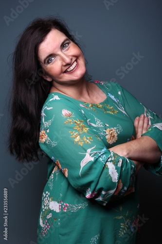 Portrait of a woman in front of a colored background