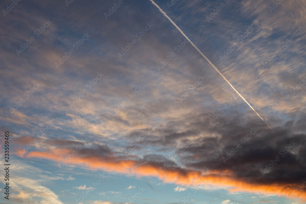 clouds illuminated by the setting sun, shot in late autumn clouds illuminated by the setting sun, shot in late autumn