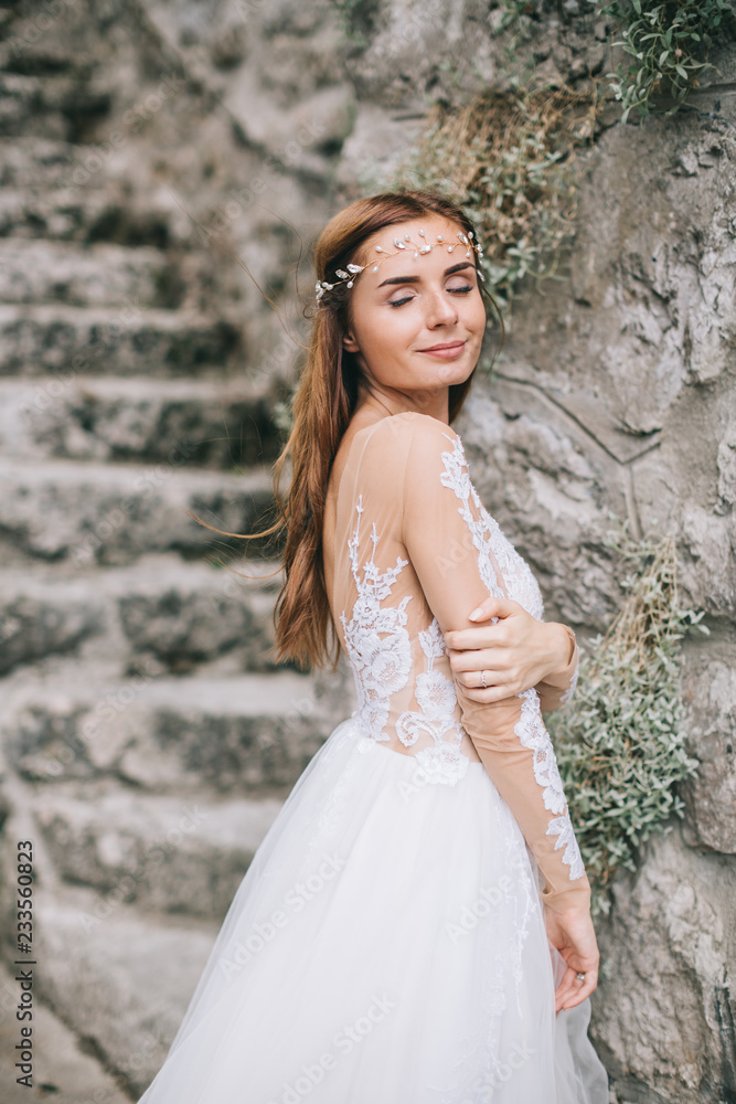A beautiful bride walks in a fairy Austrian town, Hallstatt. A beautiful bride walks in a fairy Austrian town, Hallstatt.