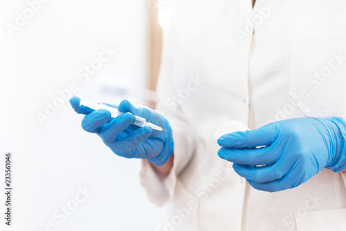 Female doctor with fillesr in hand