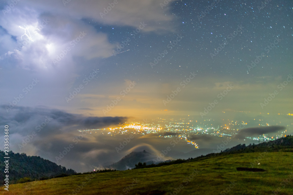 City, Stars, Clouds, Moonlight and Lightning Strike Seen from 2000m