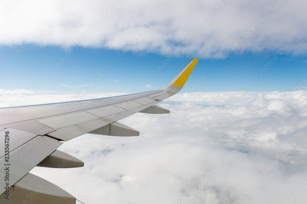 Fototapeta premium Airplane wing view from window beautiful sky.