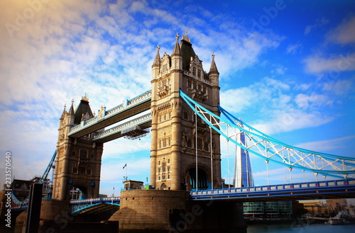 Tower Bridge in London, the UK. Sunset with beautiful clouds. Drawbridge opening. One of English symbols