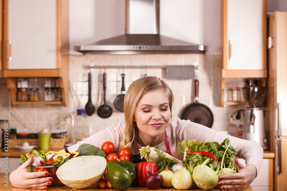 Woman having vegetables on table Woman having vegetables on table