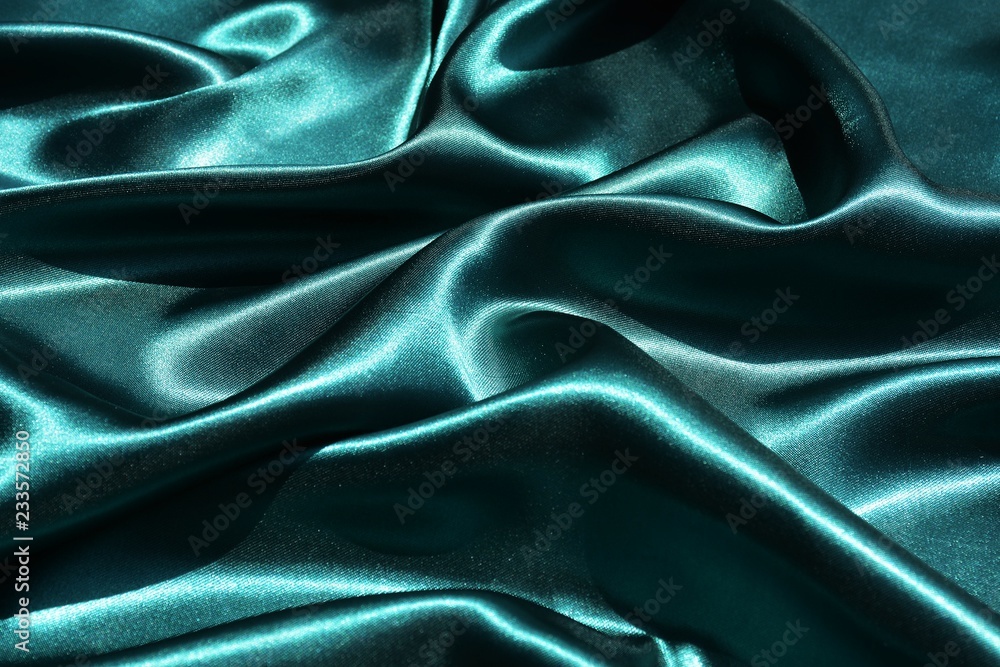 Obraz premium Emerald wavy silk background texture