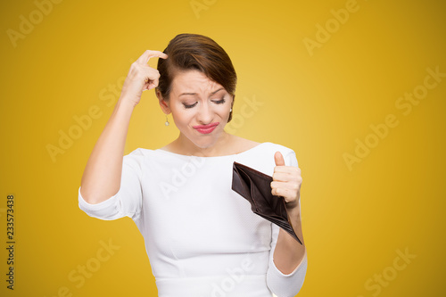Confused woman having empty wallet