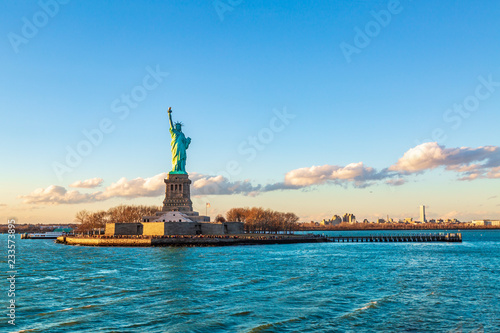 Statue of liberty horizontal during sunset in New York City  NY  USA