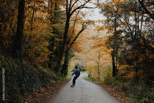 Man Skating in the Autumn Forest in Germany