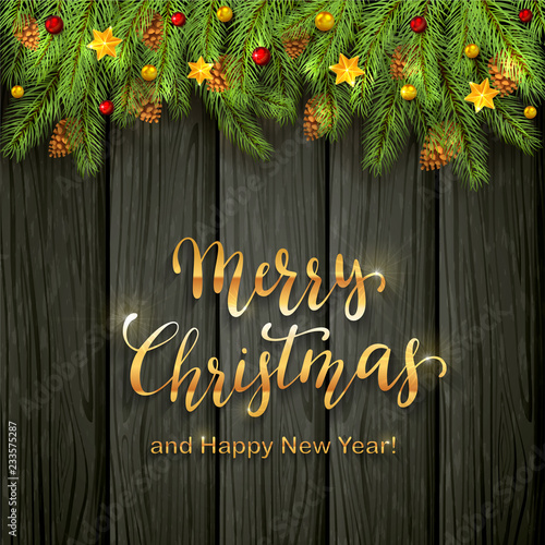Christmas Lettering on Black Wooden Background with Holiday Decorations
