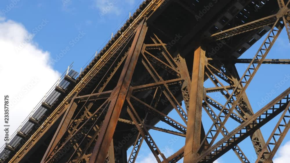 Low angle view of rusty steel trestle train bridge. Winter in Toronto, Canada. Low angle view of rusty steel trestle train bridge. Winter in Toronto, Canada.