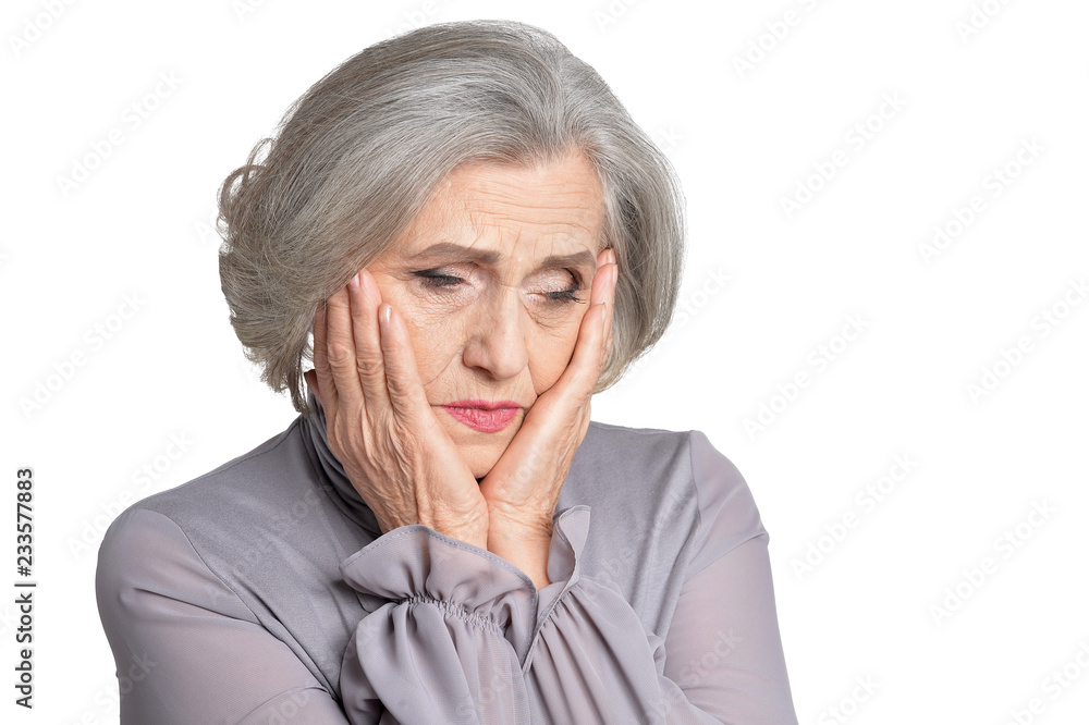 Portrait of sad senior woman on white background Portrait of sad senior woman on white background