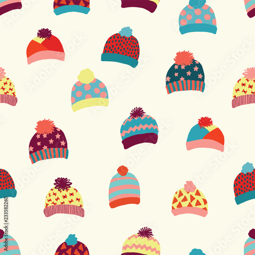 Seamless vector background knitted wool hats. Warm winter clothes wear pattern. Hand drawn cozy and warm accessories. Scandinavian Winter wear. Norwegian knit fashion. For kids, fabric, paper, decor