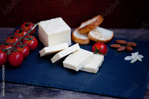 Halloumi squeaky cheese on a slate plate photo