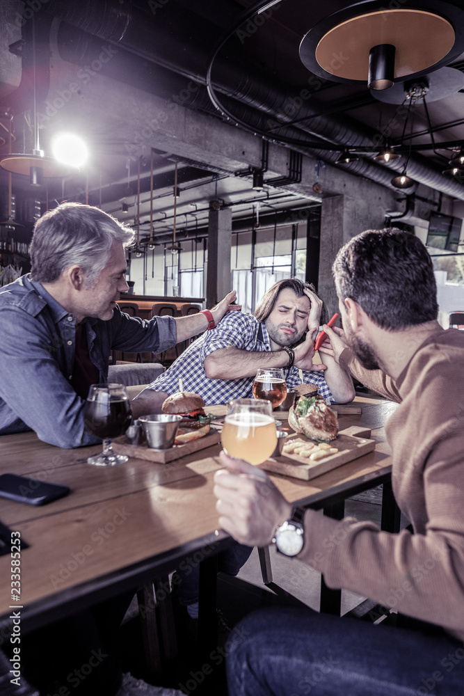 Group of colleagues that having rest in pub Group of colleagues that having rest in pub