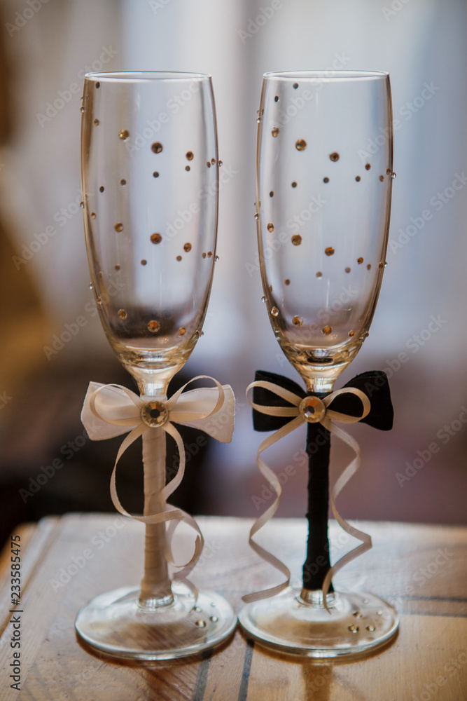 Beautiful wedding glasses for the newlyweds. Champagne glasses. glasses of the bride and groom for the wedding