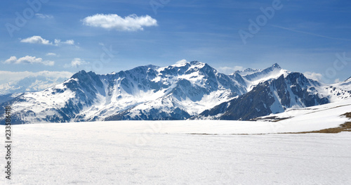 view on alpine peak mountain covered with snow in wnter  photo