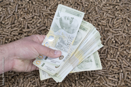 Wooden pellets and money
