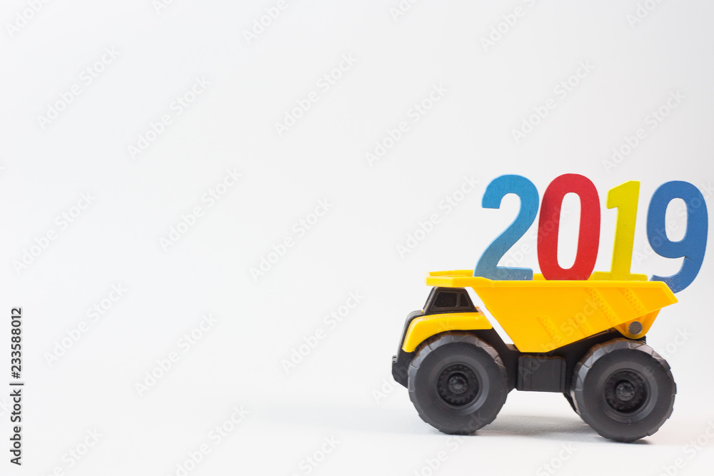 The yellow truck hold 2019 number on white background.