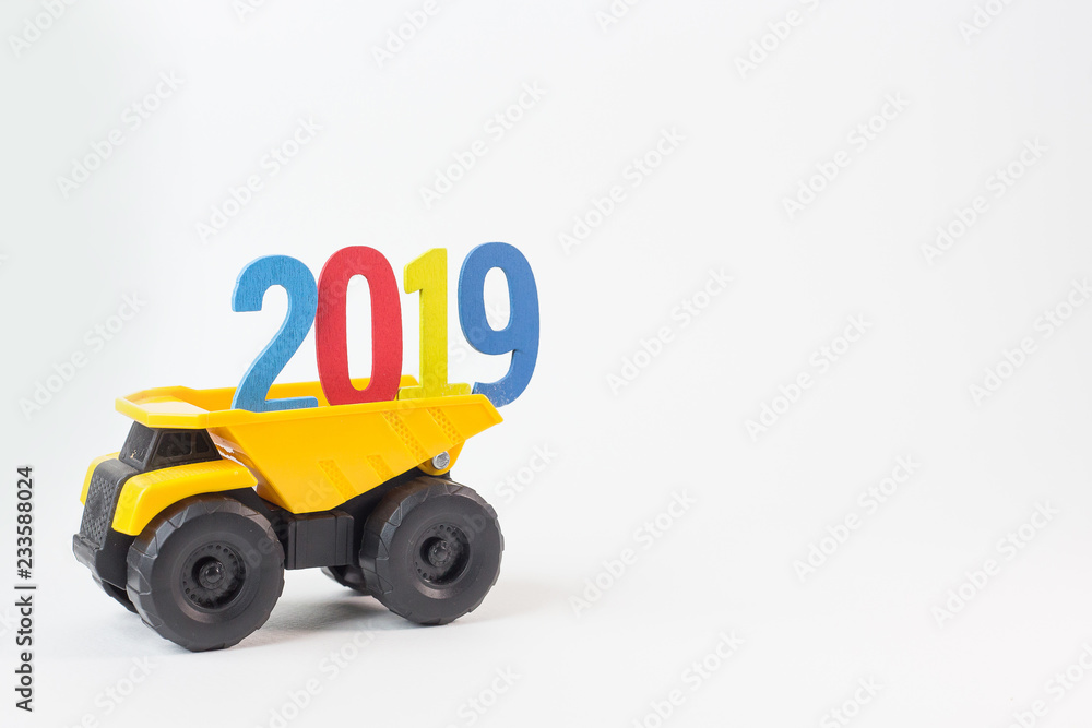 The yellow truck hold 2019 number on white background. The yellow truck hold 2019 number on white background.