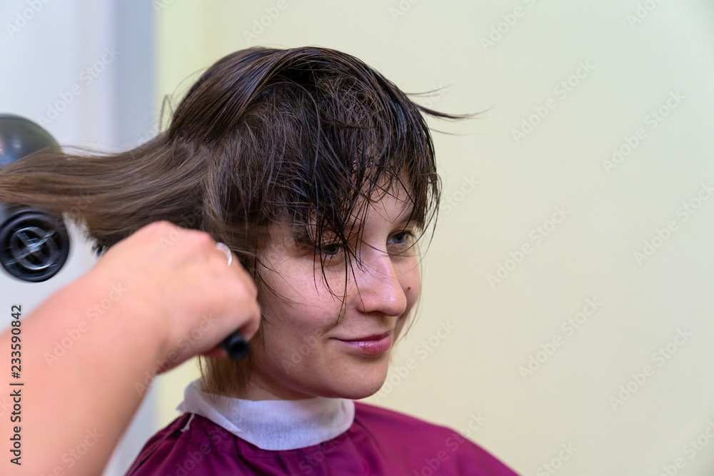 Beautiful young woman in hairstyle salon Beautiful young woman in hairstyle salon