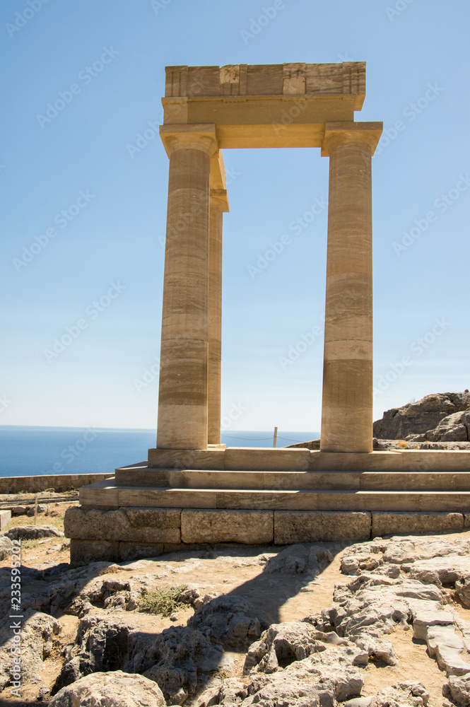 Lindos Acropolis fortified citadel during summer touristic season, archeology ruins
