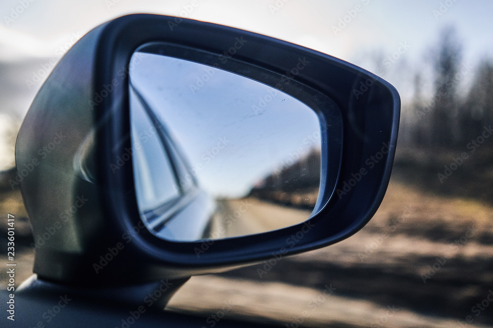 road in the car mirror