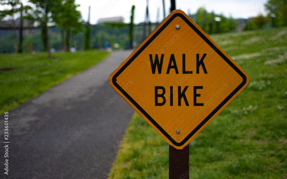 Walk bike sigh on the road background.