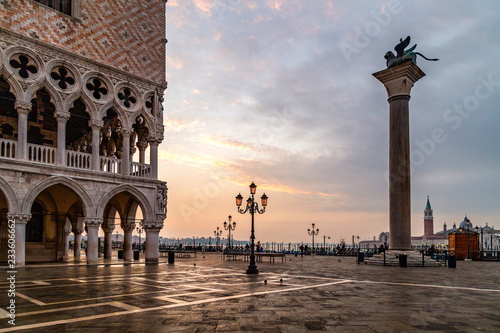San Marco square in Venice at sunrise with   Doge's Palace, Palazzo Ducale and Saint Mark Column