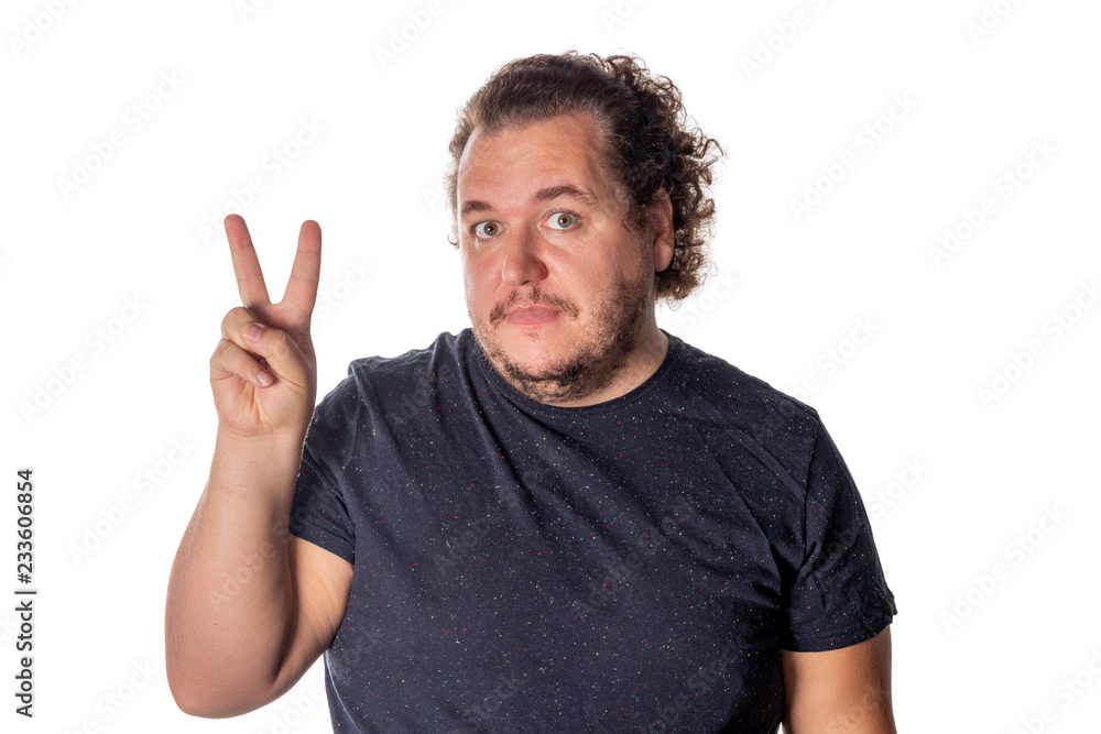 Portrait of funny fat man showing peace v-sign or victory gesture on white background Portrait of funny fat man showing peace v-sign or victory gesture on white background