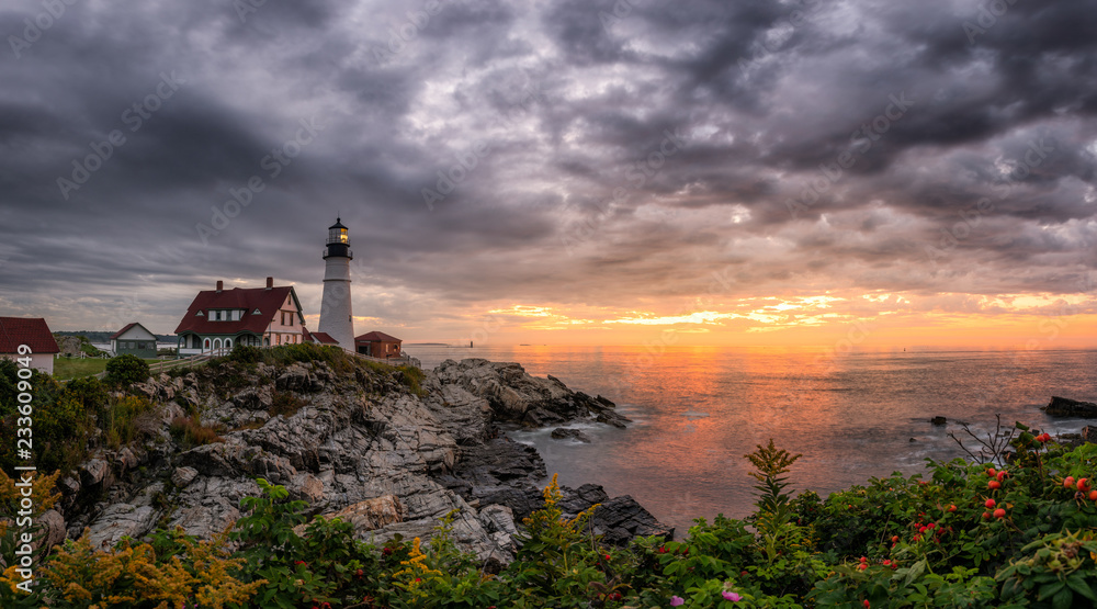 Panorama of dark clouds and a sunrise from Cape Elizabeth, Maine 