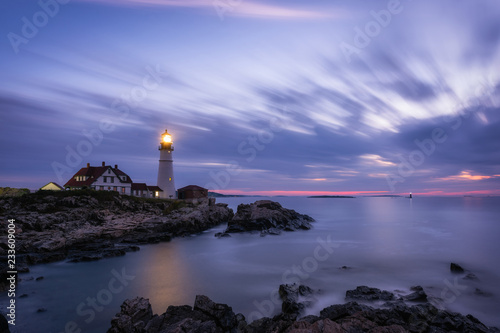 Moving clouds at dawn over Portland Head Lighthouse in Maine 