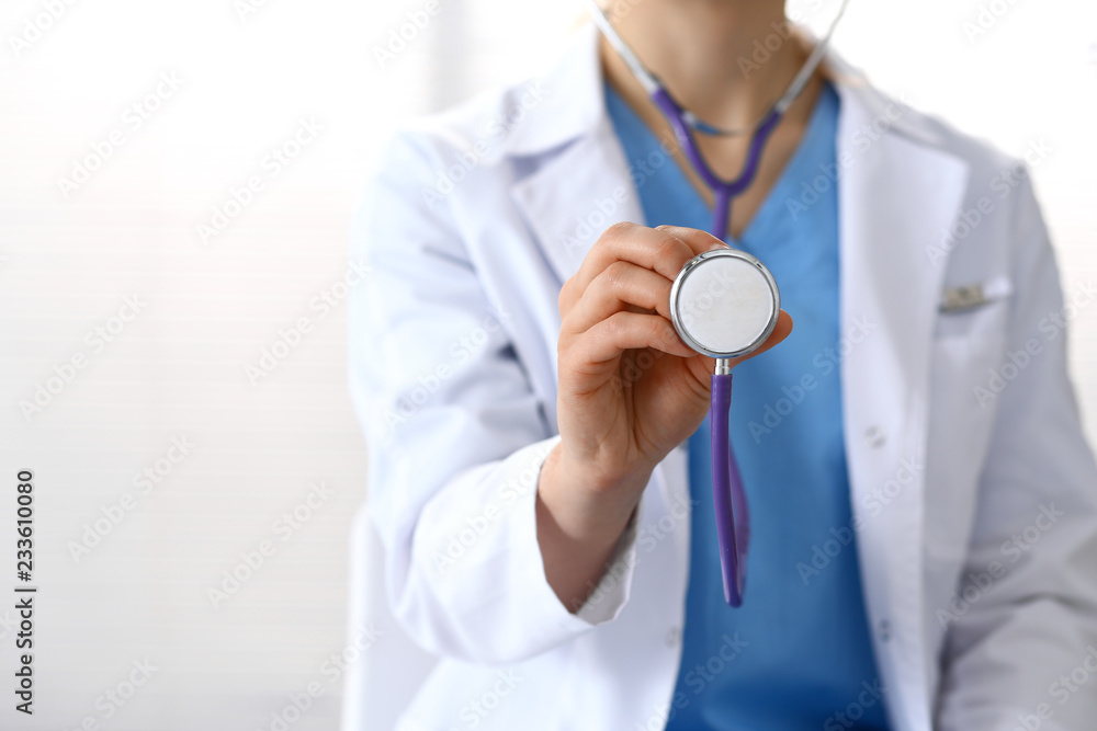 Doctor holds stethoscope head, closeup. Physician ready to examine and help patient. Medical help and insurance in health care, best treatment and medicine concept Doctor holds stethoscope head, closeup. Physician ready to examine and help patient. Medical help and insurance in health care, best treatment and medicine concept