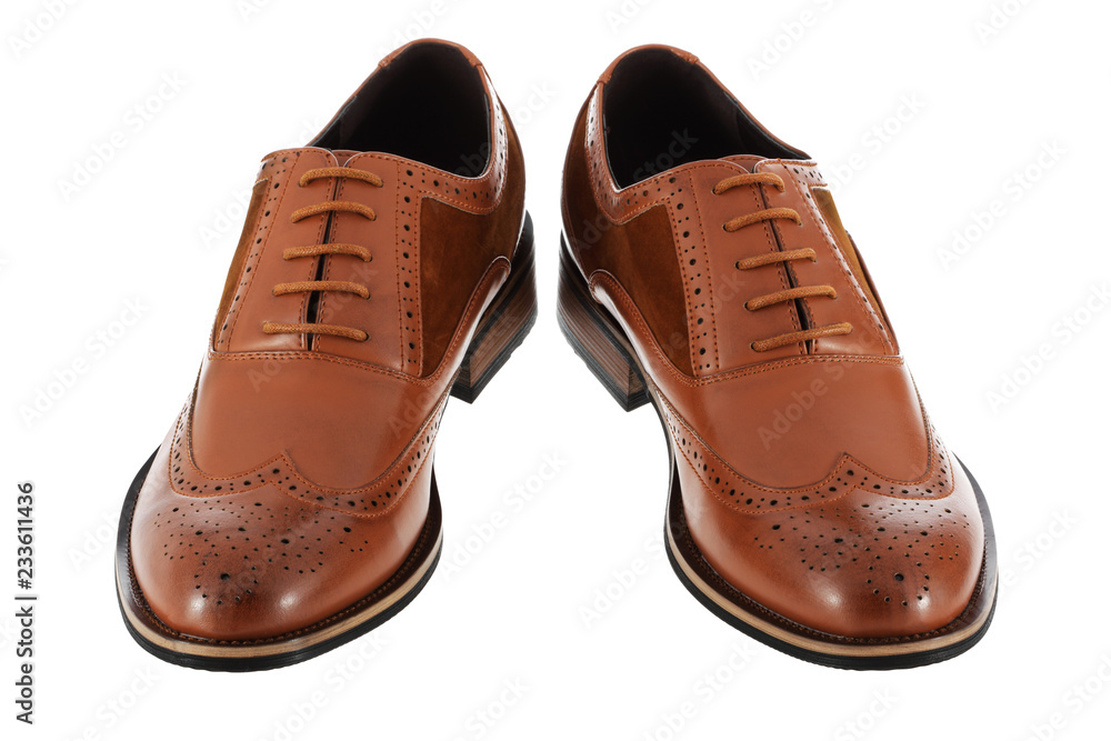 Pair of brown leather and suede mens shoes isolated on a white background with clipping path