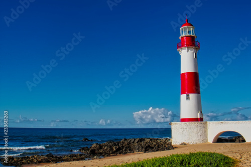 Lighthouse Itapua beach with blue sky, Salvador, Bahia, Brazil 