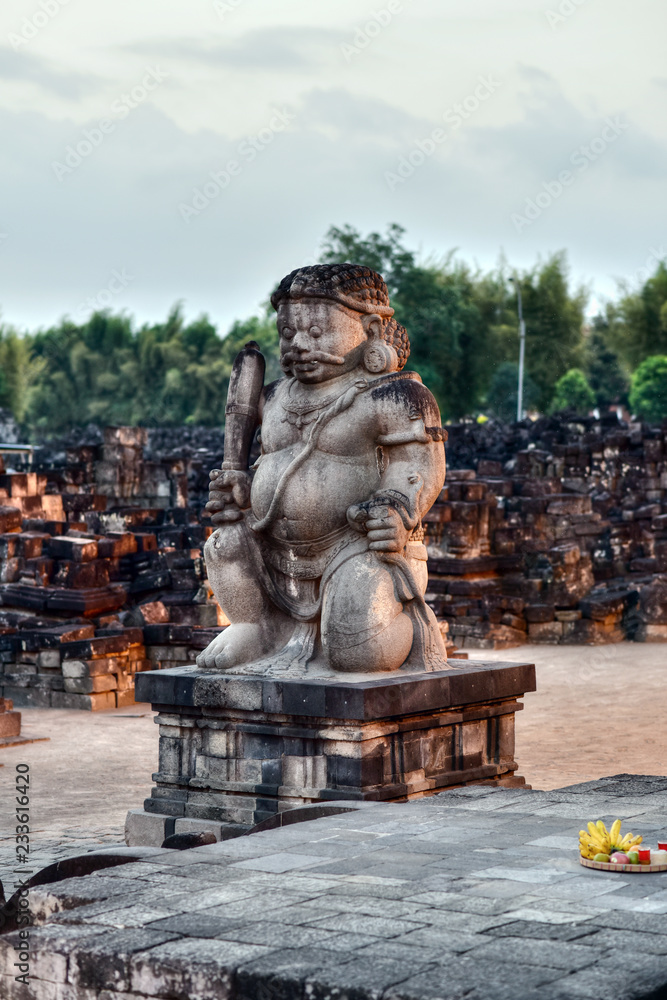 A statue of a dvarapala (guardian) at the entrance of the Candi Sewu, Prambanan Temples Comlpex, Central Java, Indonesia