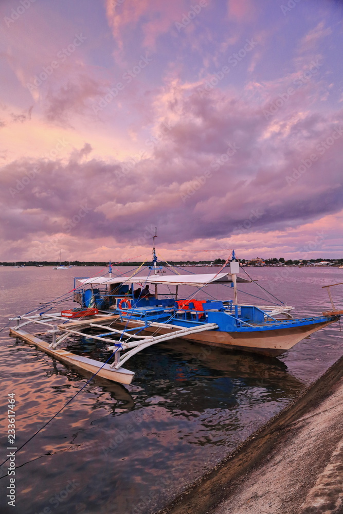 Dramatic skies-sunset over tourist balangay or bangka boat. Puerto Princesa-Palawan-Philippines-0754