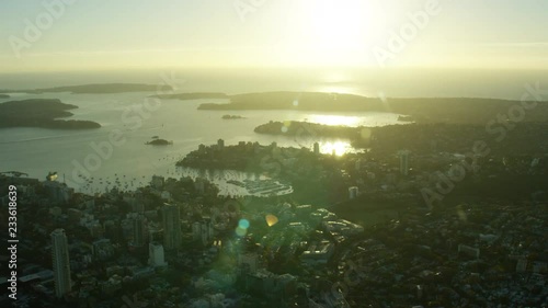 Aerial sunrise view of Sydney Harbour Bridge and ferry harbor Australia photo