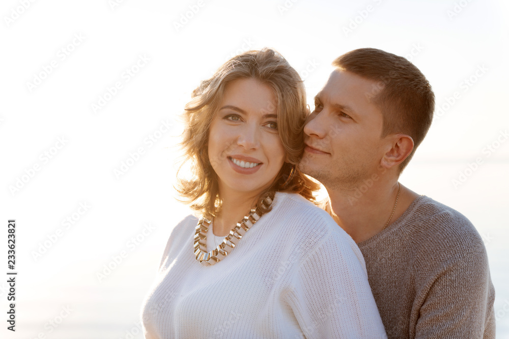 Young family romanticly hugging each other outdoor Young family romanticly hugging each other outdoor