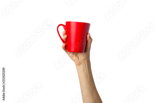 Female hand holding a red cup with hot coffee or tea on a white background. Coffee break concept, breakfast