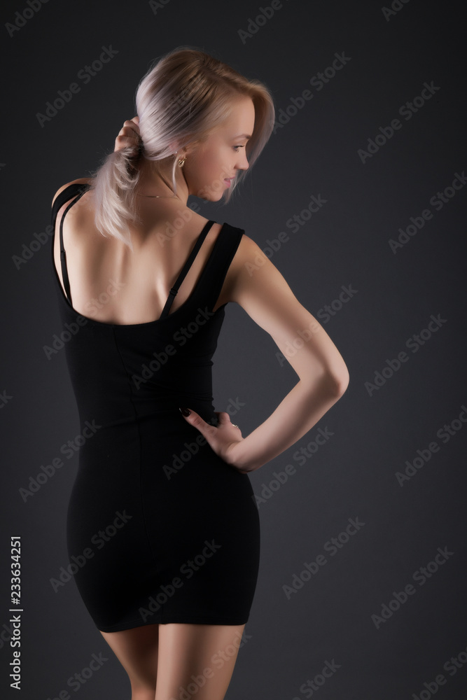 Fototapeta premium Elegant blonde on black background