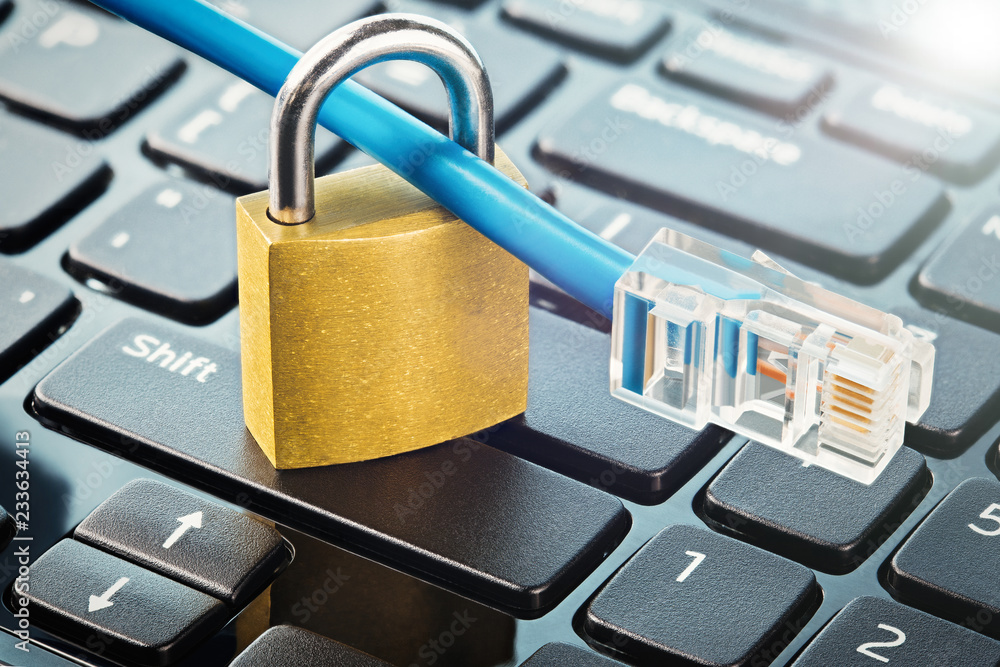 Padlock on computer keyboard with Lan cable. IT and net protection, computer safety. Network Security, data security and antivirus protection PC. Padlock on computer keyboard with Lan cable. IT and net protection, computer safety. Network Security, data security and antivirus protection PC.